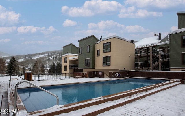 view of snow covered pool