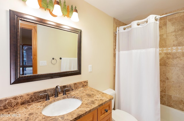 full bathroom featuring shower / bathtub combination with curtain, vanity, and toilet