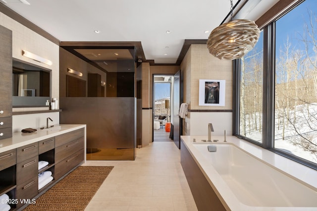 full bathroom featuring vanity, a garden tub, and recessed lighting