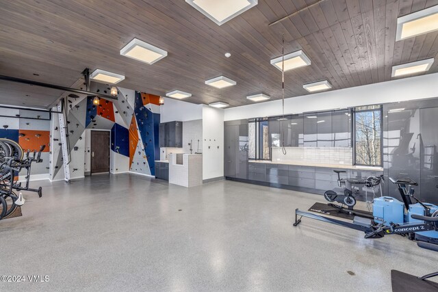 exercise room featuring wood ceiling