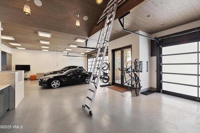 garage with wood ceiling and baseboards