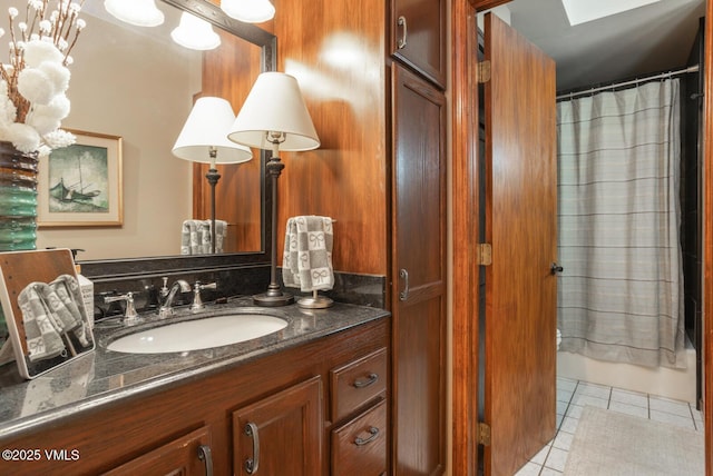 103 Meile Ln, Edwards, CO 81632 - full bath with tile patterned floors, vanity, and shower / bathtub combination with curtain