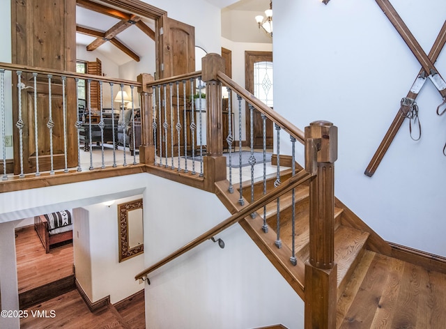 2241 Tahoe Dr, Vail, CO 81657 - staircase with wood finished floors and a chandelier