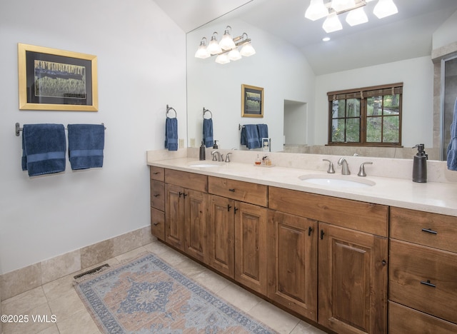 2241 Tahoe Dr, Vail, CO 81657 - bathroom featuring lofted ceiling, double vanity, and tile patterned floors