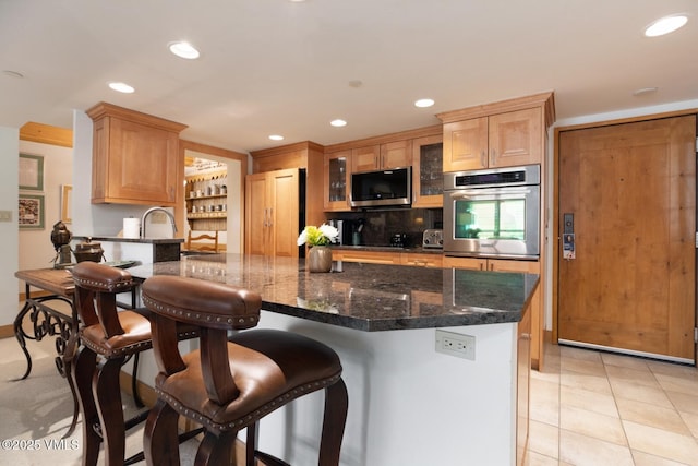 380 E Lionshead Cir Unit 160, Vail, CO 81657 - kitchen featuring oven, recessed lighting, paneled built in fridge, glass insert cabinets, and a peninsula