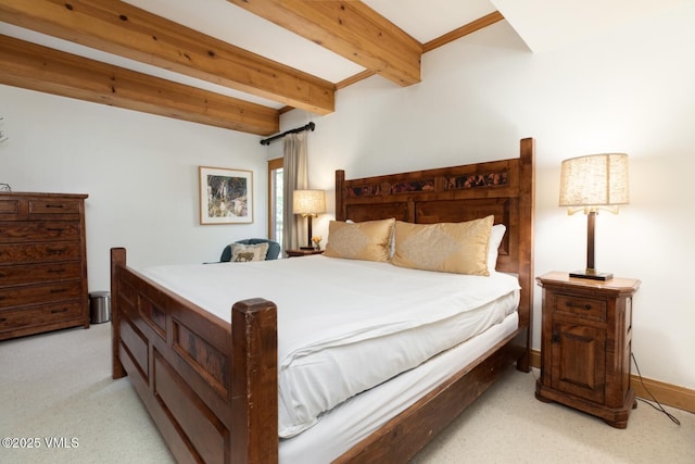 380 E Lionshead Cir Unit 160, Vail, CO 81657 - bedroom featuring light carpet and beamed ceiling