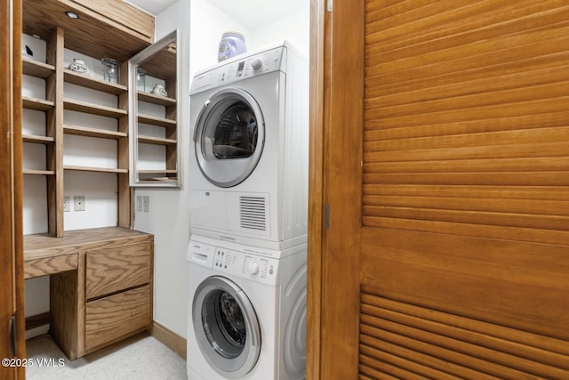 380 E Lionshead Cir Unit 160, Vail, CO 81657 - laundry area featuring stacked washer and clothes dryer and baseboards