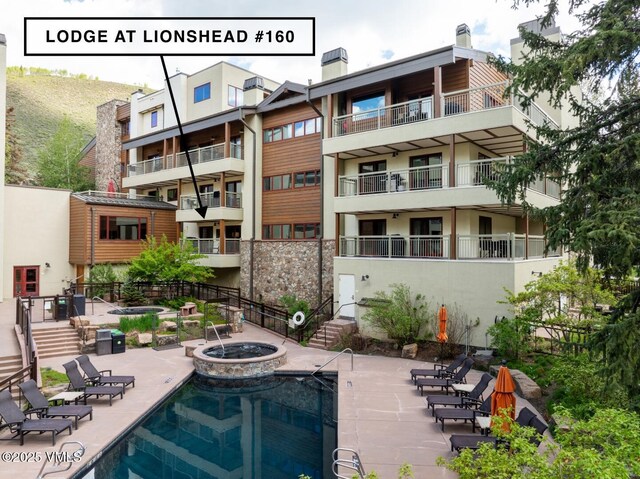 380 E Lionshead Cir Unit 160, Vail, CO 81657 - community pool with a patio area and a community hot tub