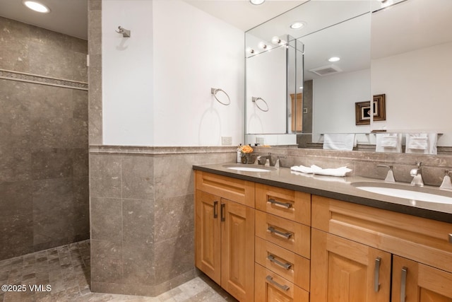 380 E Lionshead Cir Unit 160, Vail, CO 81657 - full bathroom featuring tile walls, double vanity, walk in shower, and recessed lighting