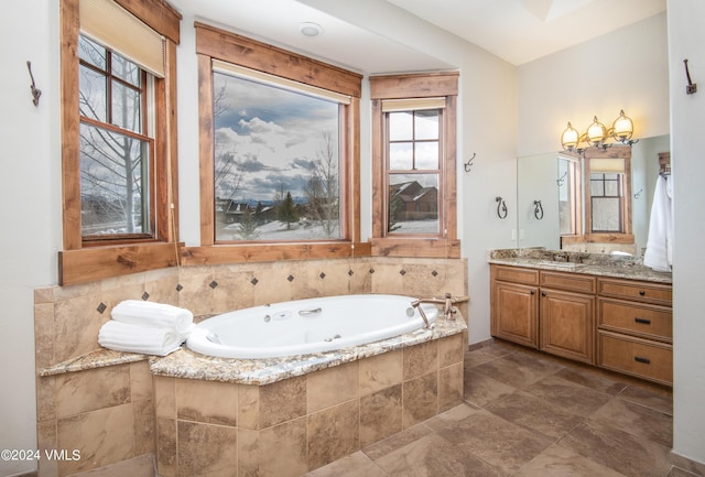 full bathroom with a jetted tub and vanity