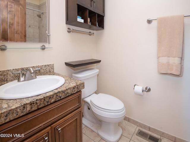 full bath featuring visible vents, toilet, vanity, baseboards, and tile patterned floors