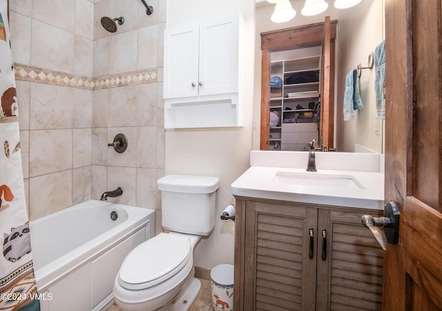 full bathroom featuring shower / bath combo, vanity, and toilet