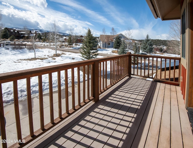 view of snow covered deck