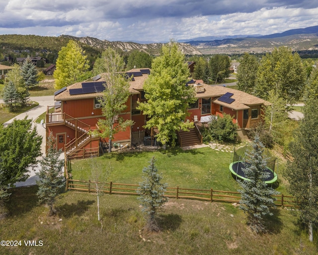 birds eye view of property with a mountain view