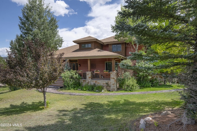 view of front of home featuring a porch and a front lawn