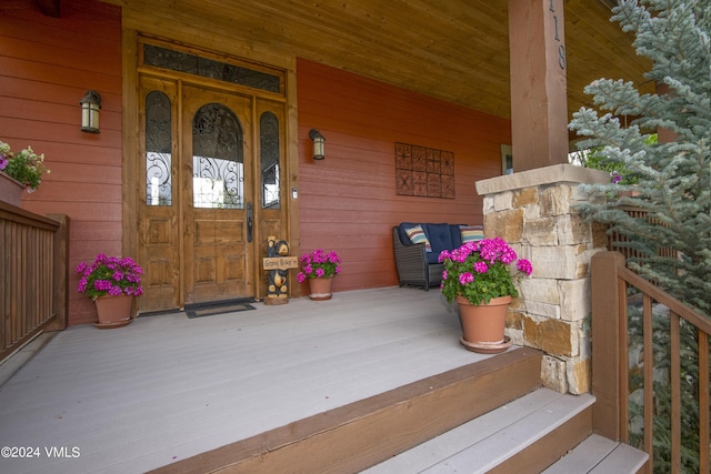 doorway to property featuring a porch