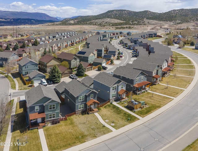birds eye view of property with a residential view and a mountain view
