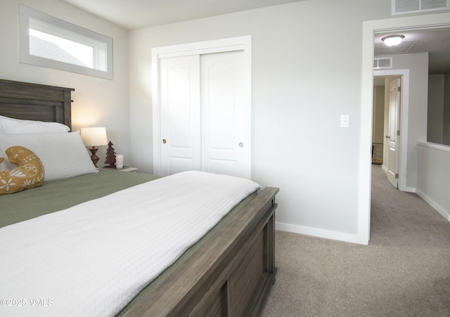 bedroom featuring light colored carpet, baseboards, visible vents, and a closet