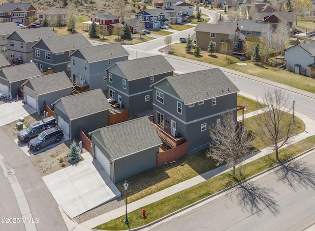 birds eye view of property with a residential view