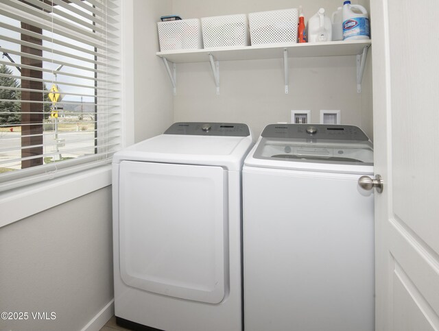 clothes washing area featuring laundry area and independent washer and dryer