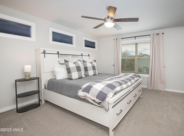 bedroom featuring light carpet, baseboards, and ceiling fan