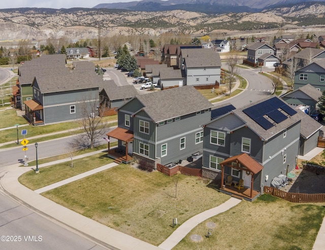 birds eye view of property with a residential view and a mountain view