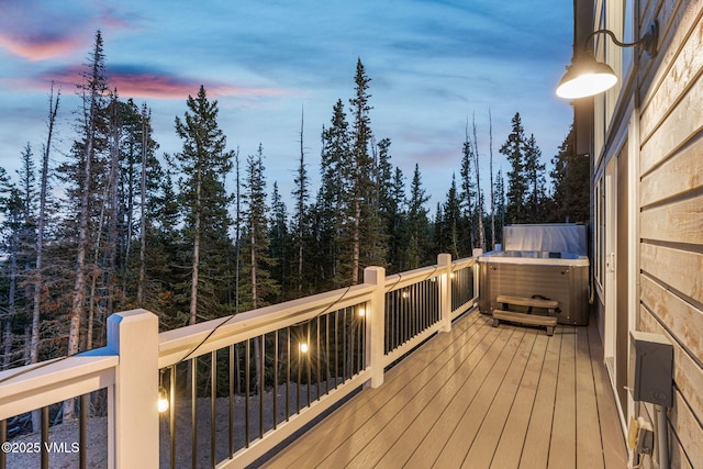 408 El Lobo Ln, Fairplay, CO 80440 - wooden terrace featuring a hot tub and a wooded view