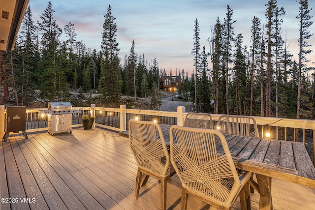 408 El Lobo Ln, Fairplay, CO 80440 - deck at dusk with outdoor dining area and grilling area