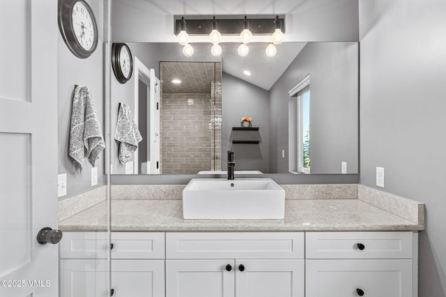 408 El Lobo Ln, Fairplay, CO 80440 - bathroom featuring vanity, a tile shower, and vaulted ceiling