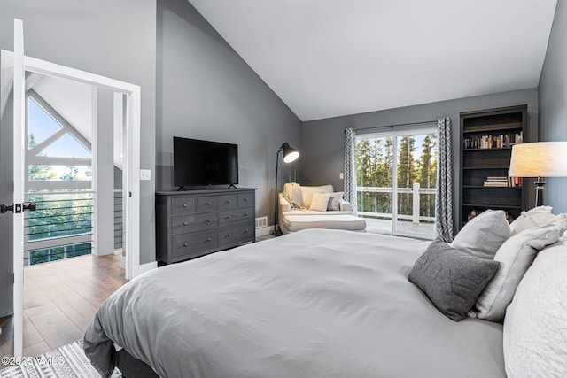 408 El Lobo Ln, Fairplay, CO 80440 - bedroom with wood finished floors, access to outside, and high vaulted ceiling