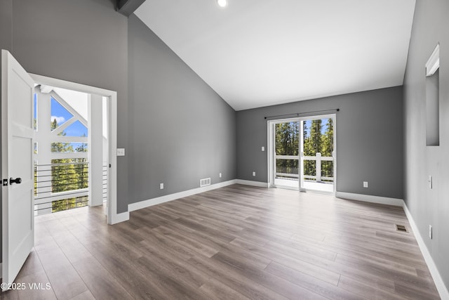 408 El Lobo Ln, Fairplay, CO 80440 - empty room featuring wood finished floors, high vaulted ceiling, and recessed lighting
