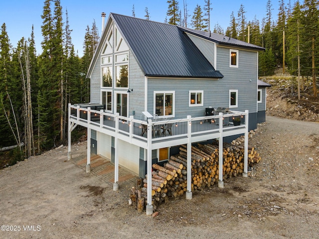 408 El Lobo Ln, Fairplay, CO 80440 - rear view of house with a deck, a metal roof, and driveway