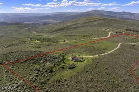 6306 Bellyache Ridge Rd, Wolcott, CO 81655 - aerial view of sparsely populated area with property parcel outlined and mountains