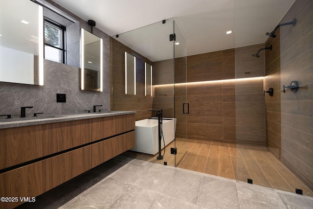 366 Forest Rd, Vail, CO 81657 - full bath with a shower stall, double vanity, tile walls, and tasteful backsplash