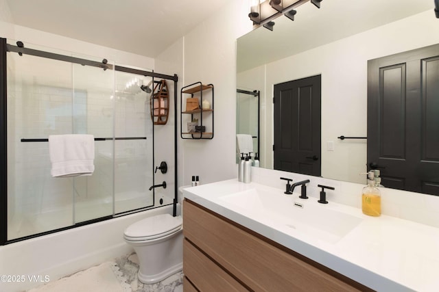 670 Winslow Rd, Edwards, CO 81632 - full bathroom featuring vanity, enclosed tub / shower combo, and toilet