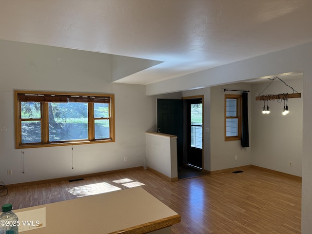 1000 Homestead Dr Unit 30, Edwards, CO 81632 - unfurnished living room with wood finished floors and baseboards