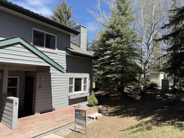 1000 Homestead Dr Unit 30, Edwards, CO 81632 - view of home's exterior with a chimney