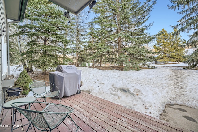 snow covered deck with grilling area