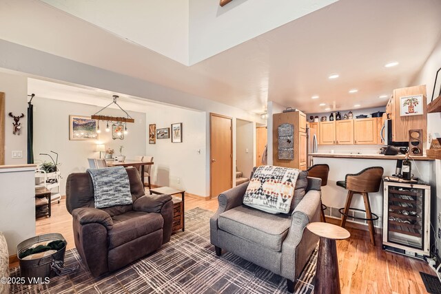 living room featuring wine cooler and hardwood / wood-style flooring