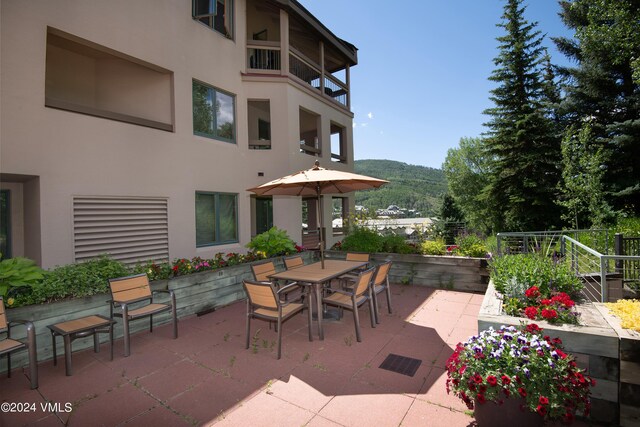 view of patio / terrace featuring a balcony and a mountain view