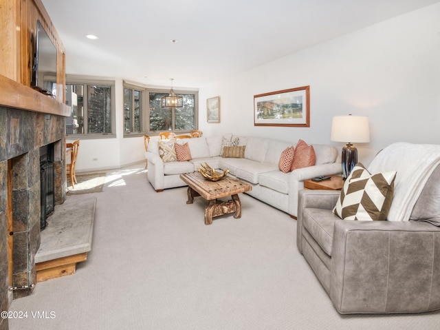 carpeted living room featuring a fireplace