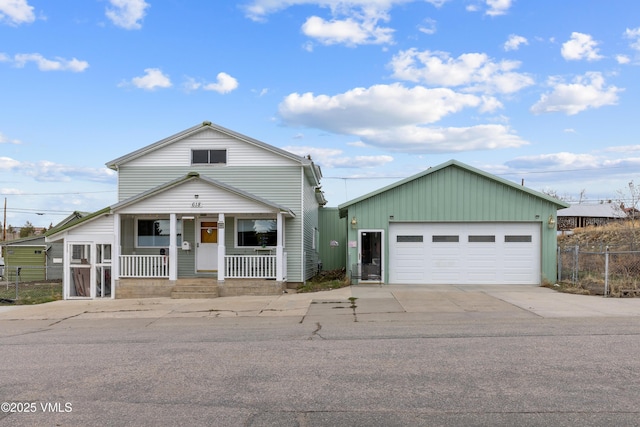 618 W Chestnut St, Leadville, CO 80461 - view of front of home featuring covered porch, fence, and a detached garage