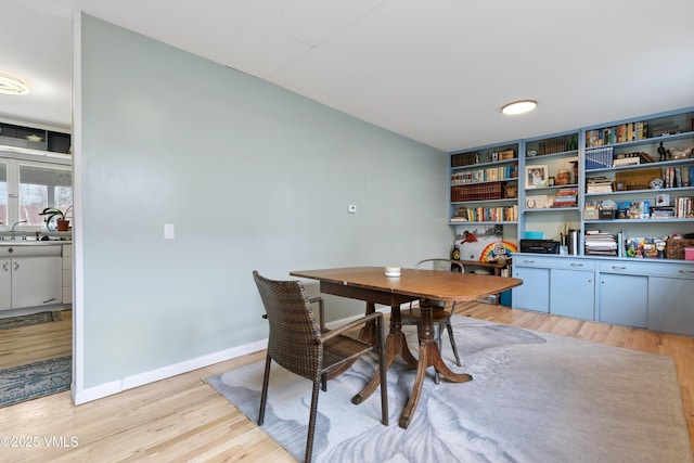 618 W Chestnut St, Leadville, CO 80461 - dining area with light wood-style flooring and baseboards