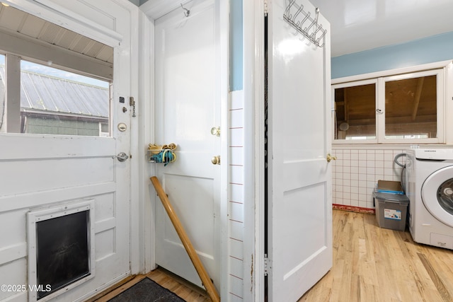 618 W Chestnut St, Leadville, CO 80461 - washroom featuring washer / dryer, light wood-type flooring, and tile walls