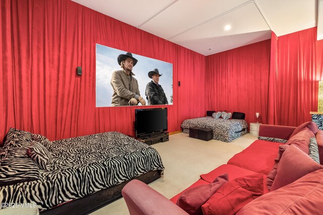 carpeted bedroom featuring wood walls