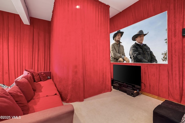 home theater with carpet floors and wood walls