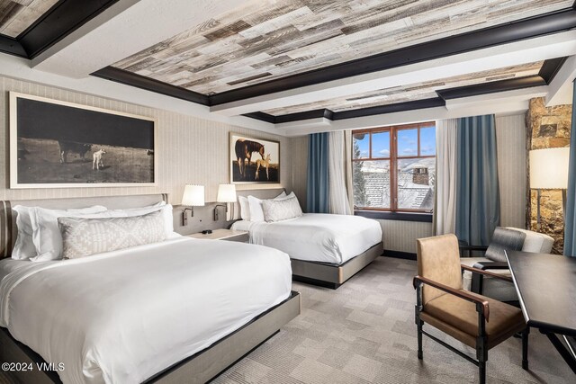 carpeted bedroom featuring crown molding and a raised ceiling