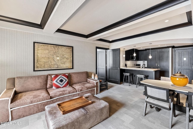 carpeted living room featuring beam ceiling