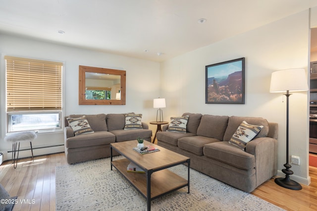 909 Red Sandstone Rd Unit B2, Vail, CO 81657 - living room featuring a baseboard radiator, wood finished floors, and recessed lighting