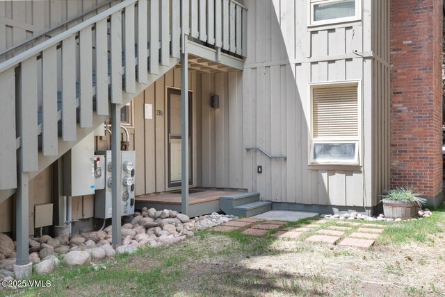 909 Red Sandstone Rd Unit B2, Vail, CO 81657 - doorway to property featuring board and batten siding and brick siding